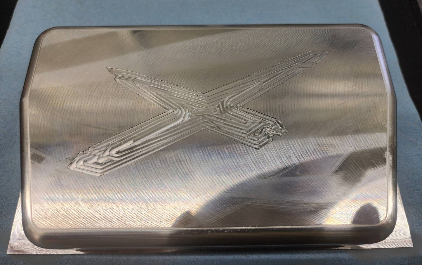 Billet Rugged Radio cover with X3 logo in raw aluminum finish