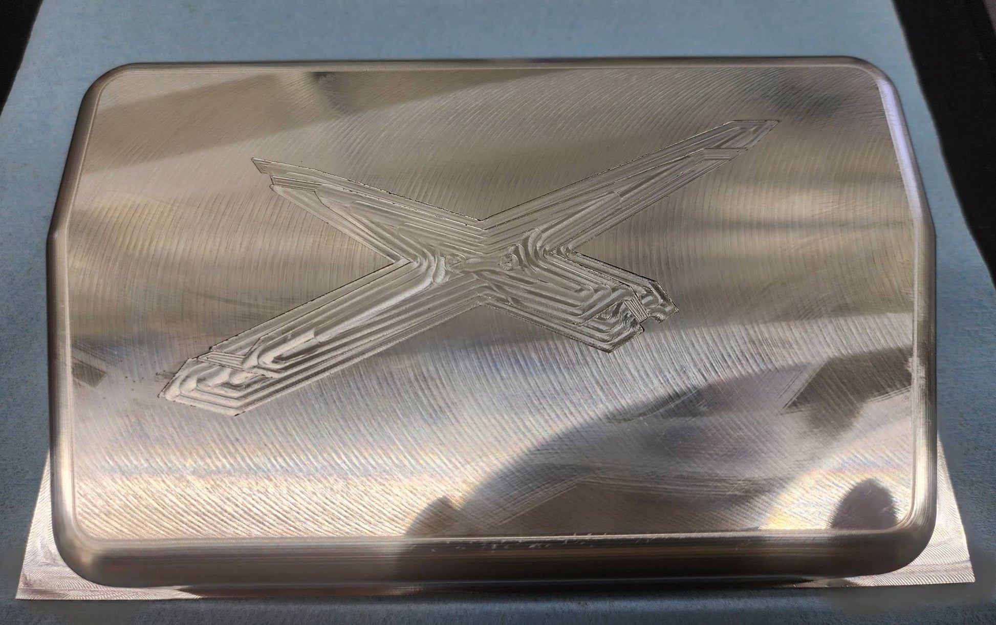 Billet Rugged Radio cover with X3 logo in raw aluminum finish