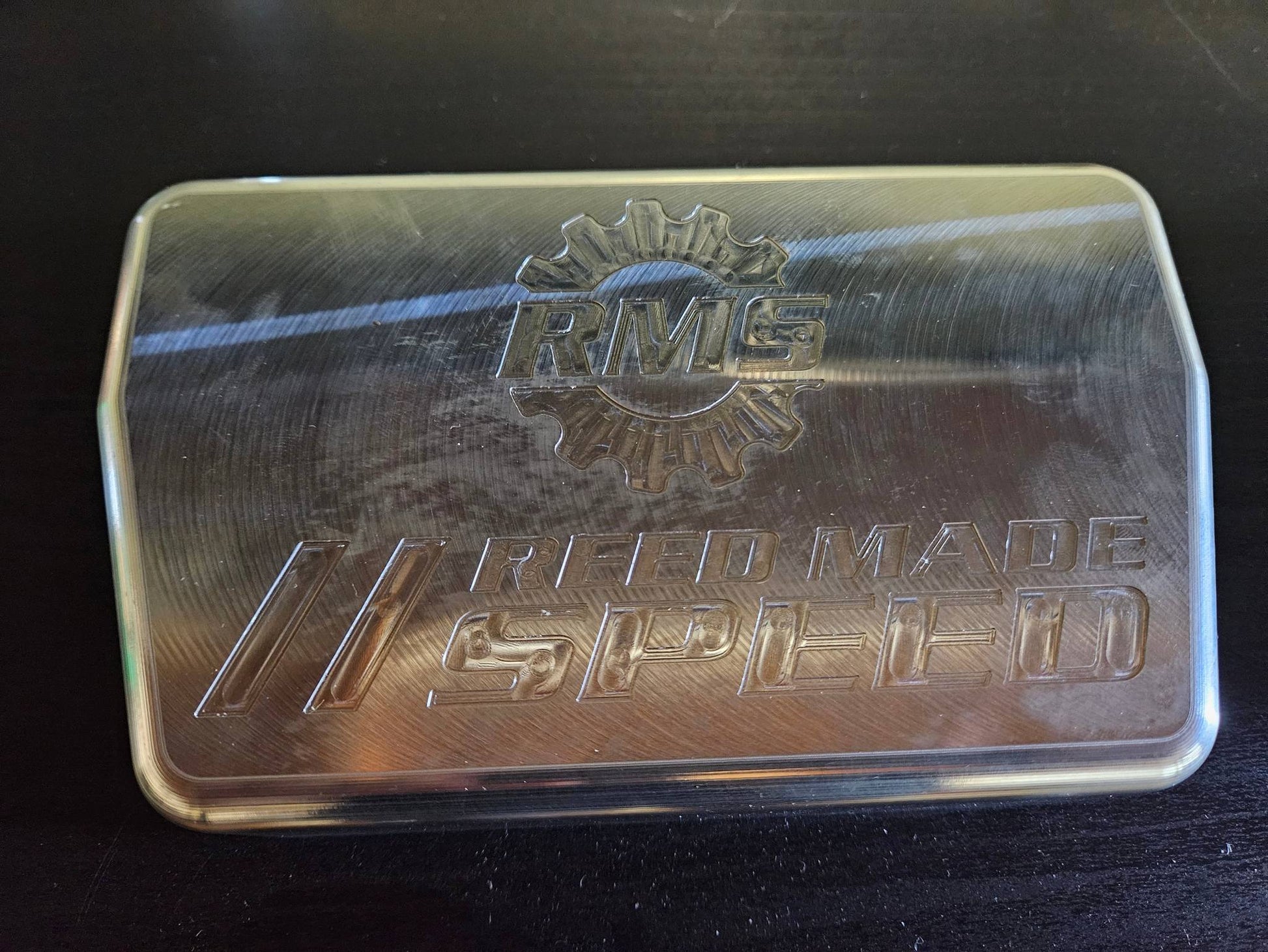 Billet machined Rugged Radio cover with Reed Made Speed logo