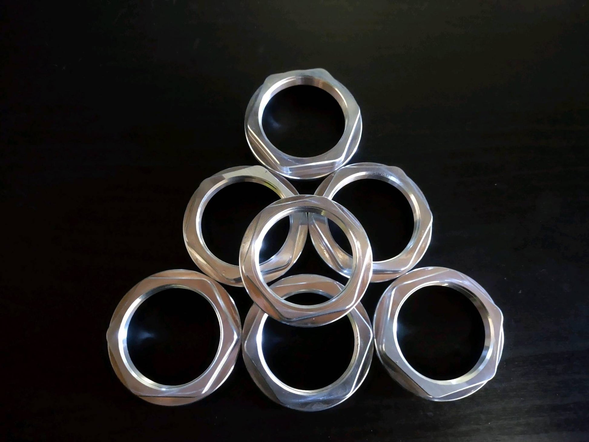 Stack of precision-machined mounting nuts for Can-Am X3 Switch Pros 9100 mount